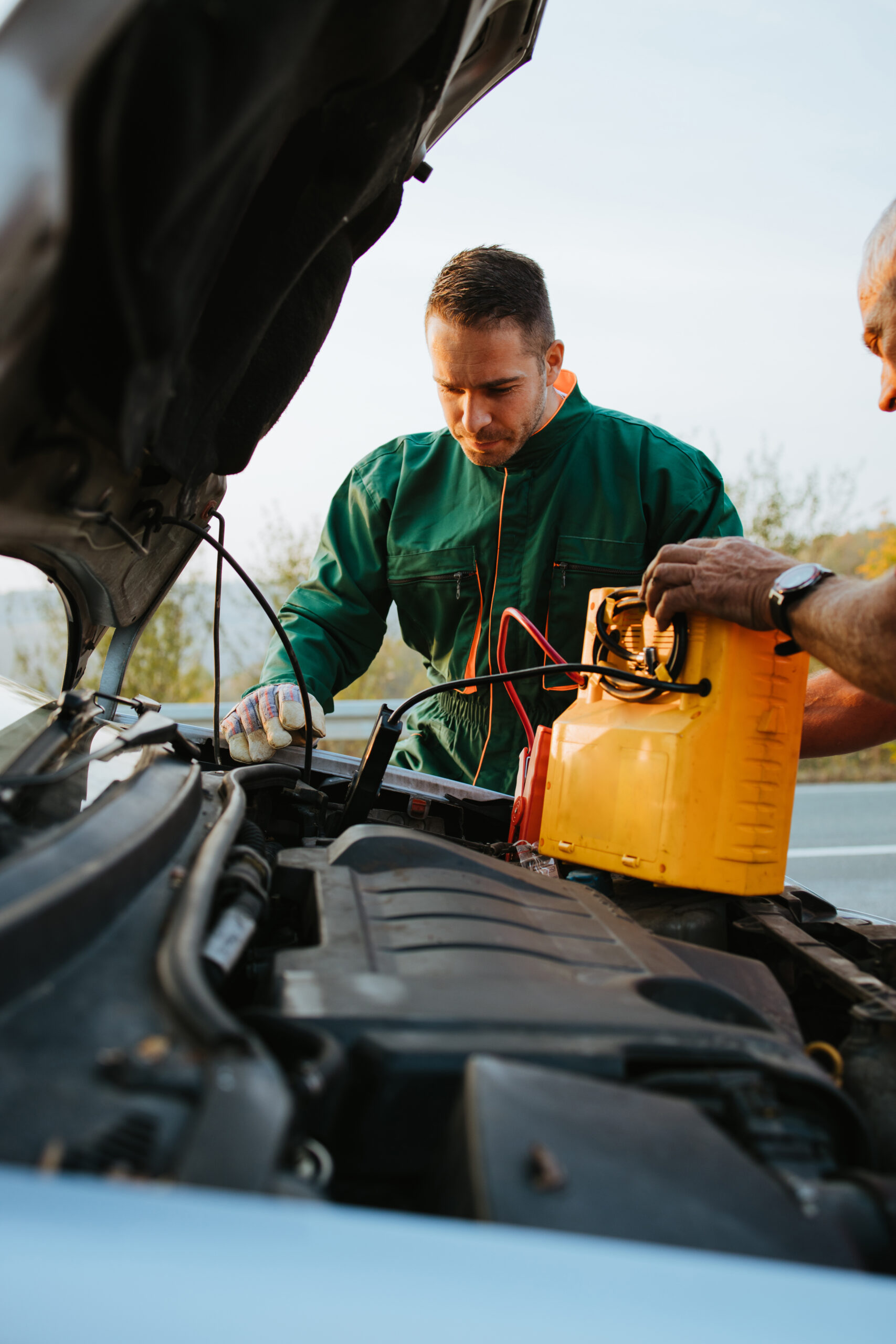 Howdy, folks! Picture this: A seasoned mechanic decked out in a green coverall is workin' diligently under the open hood of a car, fine-tunin' that engine with top-notch diagnostic equipment. Right beside him, there's another hand lendin' some support, sportin' a sleek watch on their wrist. They're both set in an outdoor backdrop that'll make ya feel right at home, with lush trees and a crystal-clear Texas sky stretchin’ far and wide.</p>
<p>Here at Dallas Towing Service, we bring that same trusty expertise to every tow and roadside assistance call we handle. So whether you find yourself stuck on a lonely road or needing some heavy-liftin', count on us to get the job done right! Y'all stay safe out there!